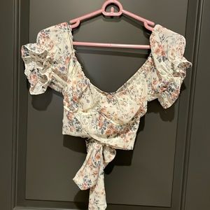 womens M floral blouse with tie back and cross front